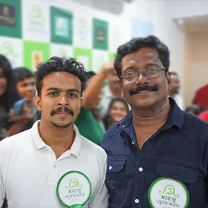 Artist Aadi, the best graphic design tutor in Kerala, takes a photo with Mollywood actor Appunni Sasi.