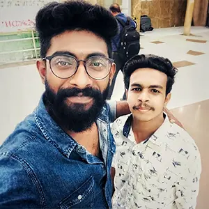 Artist Aadi, Kerala's best graphic design tutor, takes a selfie with Mollywood actor Pareekutty from the movie 'Happy Wedding'